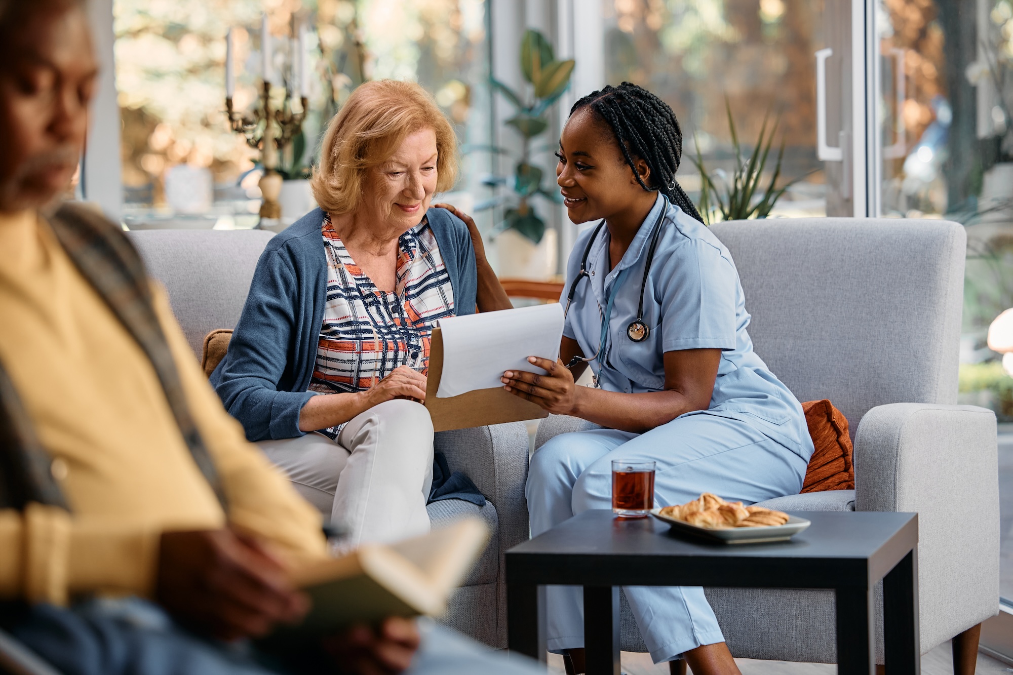 Trinity caregiver reviewing a personalized care plan with a senior client