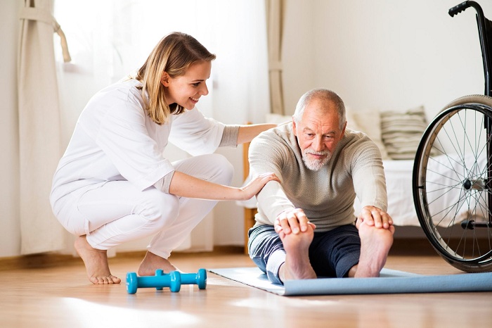 Caregiver providing mobility and safety support for a senior